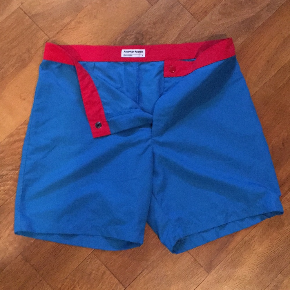 Blue swim trunks with red trim waist